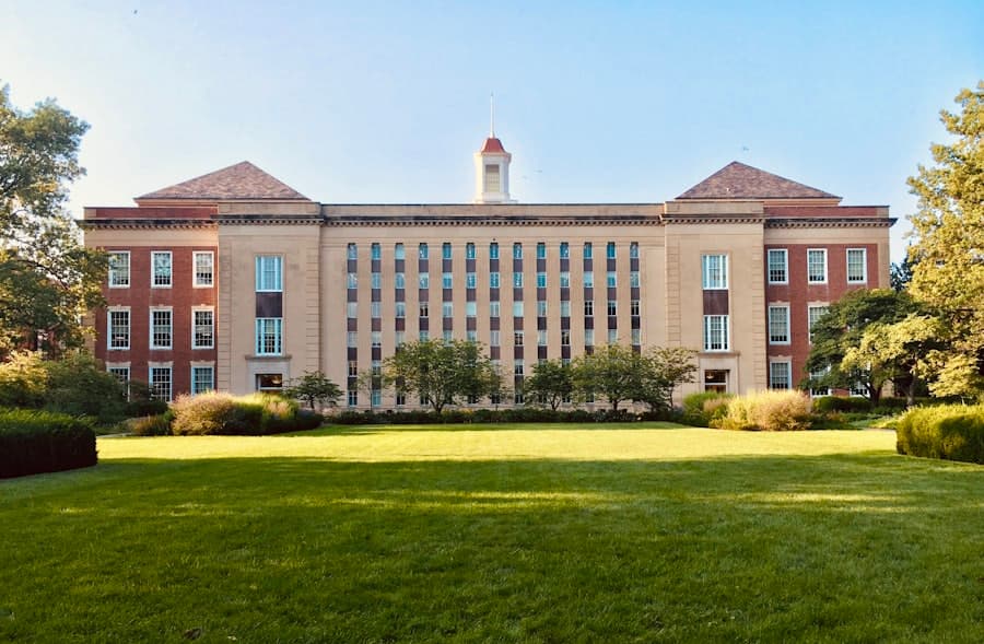 University campus building behind a green lawn