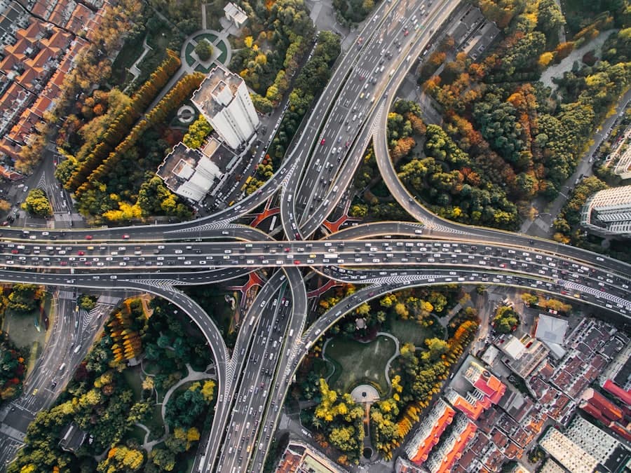 Multi-lane highway curving through a landscaped urban corridor