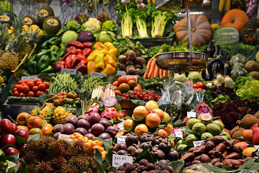 Market stalls with fresh produce under canvas awnings